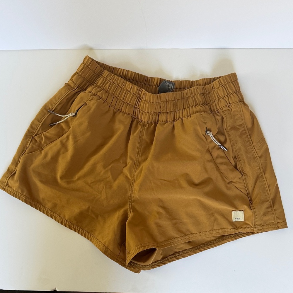 Vuori Women's Athletic Shorts in mustard gold